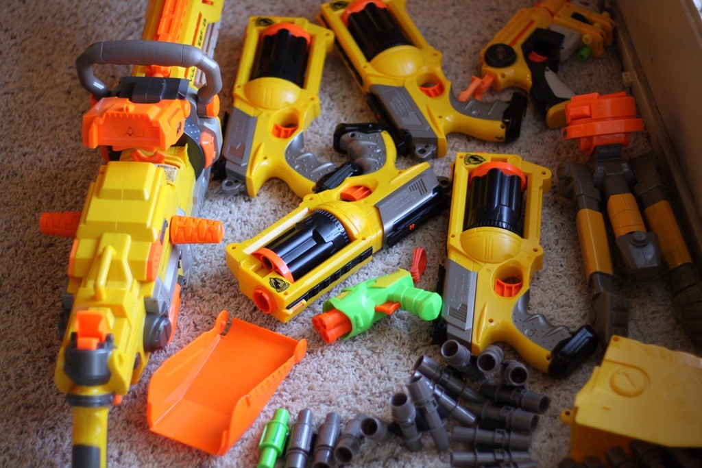 Players spread across a field mid game, the shape most Nerf war games take