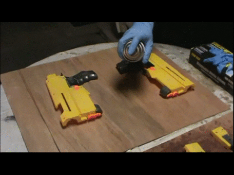 Spraying primer onto a Nerf blaster shell in short bursts