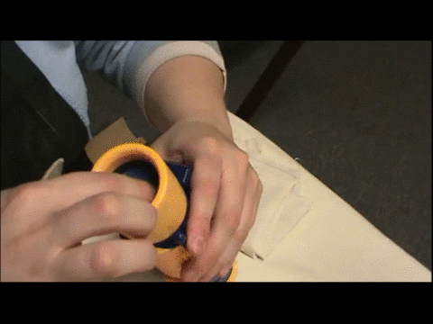 Masking off a Nerf blaster scope lens with tape