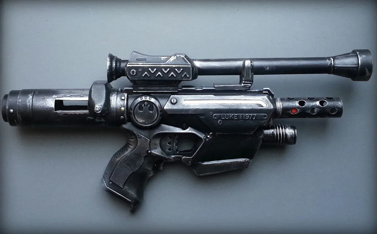Modded Nerf blaster with the shell open on a workbench mid-upgrade
