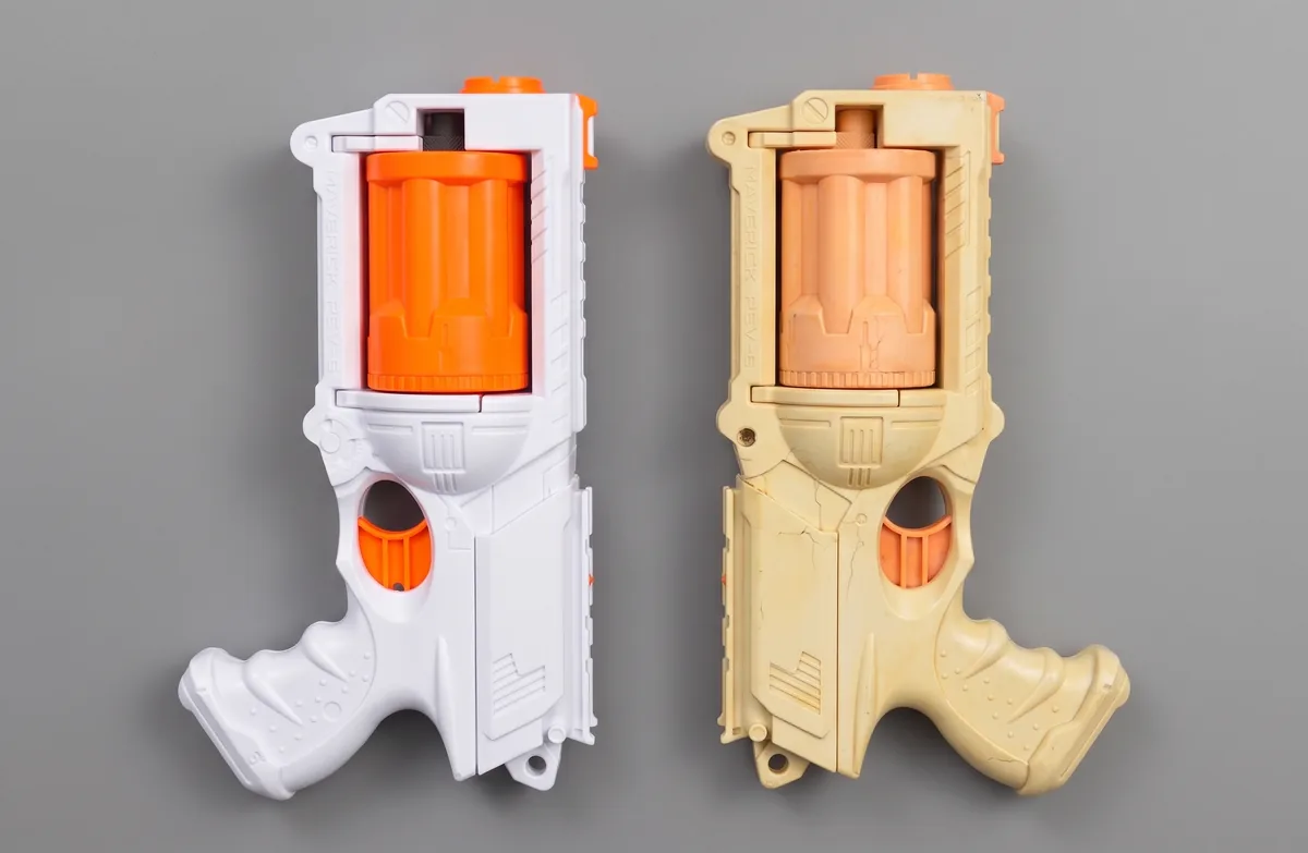 Two Maverick REV-6 shells side by side, one crisp white and one aged to cream, the ageing to check for in daylight